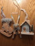 Set of 3 tree hanging skies, ice skates and lodge.
