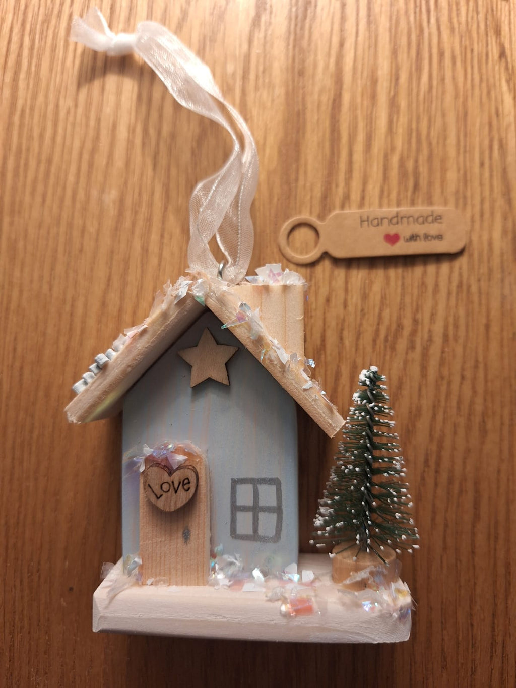 Set of 3 tree hanging skies, ice skates and lodge.